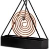 Coil holder holding a coil upright on a countertop