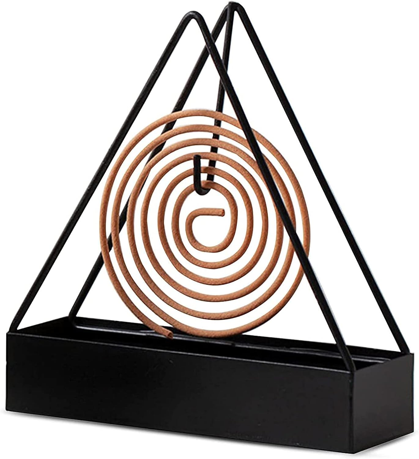 Coil holder holding a coil upright on a countertop