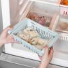 Before and after comparison showing a cluttered fridge transformed with the organizer basket