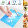 Hand rolling out naan dough on the vibrant multicolor silicone mat