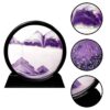 Black circular kinetic sand art frame with purple mountain designs on a metal stand